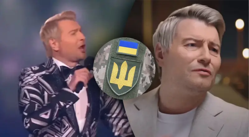 Микола Басков з емблемою ЗСУ та українським прапором на тлі сцени