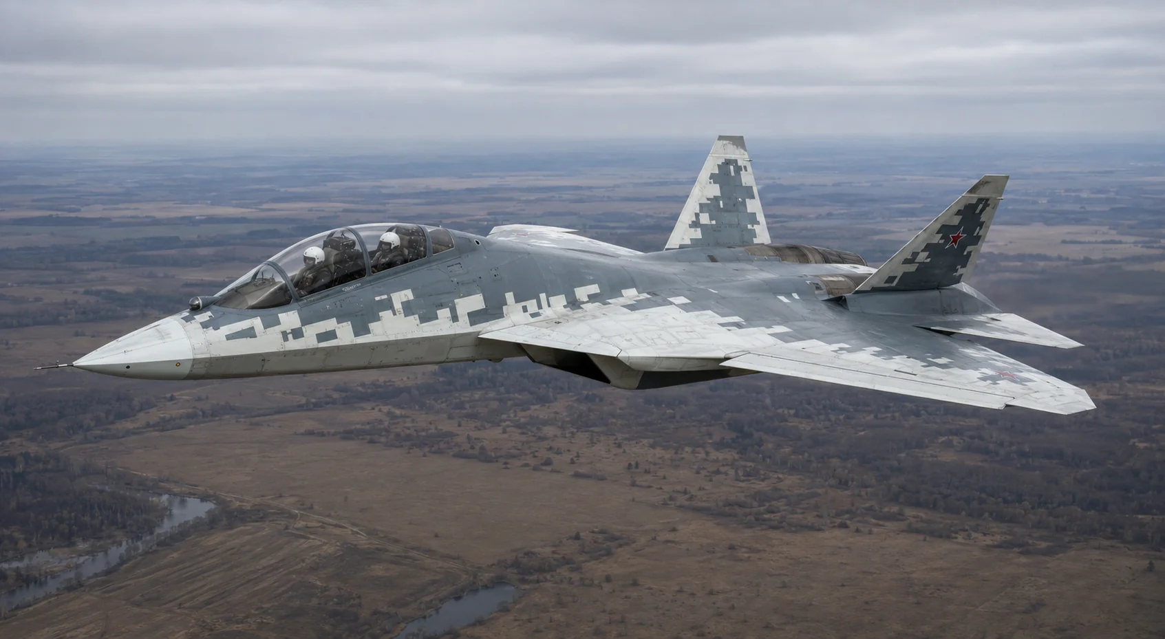 Двомісний Су-57Д у польоті над рівнинною місцевістю